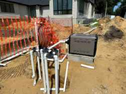 Pool heater beside outdoor pool equipment